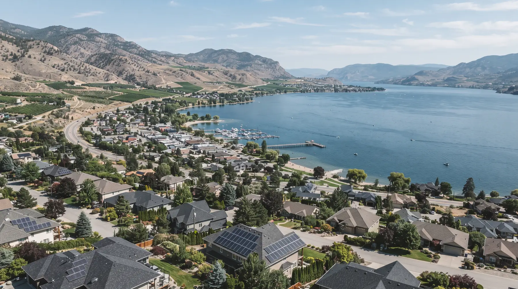 Peachland homes with rooftop solar above the waterfront and Okanagan Lake, near Peachland